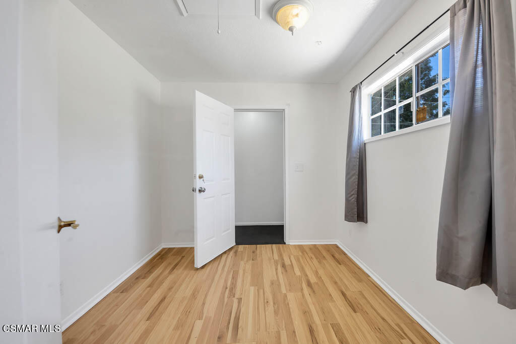 2039 Madrone Street Simi Valley, CA 93065 - Photo 9 of 35 a view of a room with wooden floor and staircase