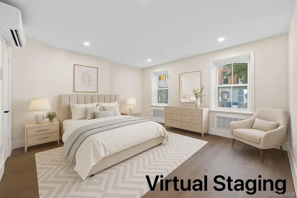 a spacious bedroom with a bed and a couch