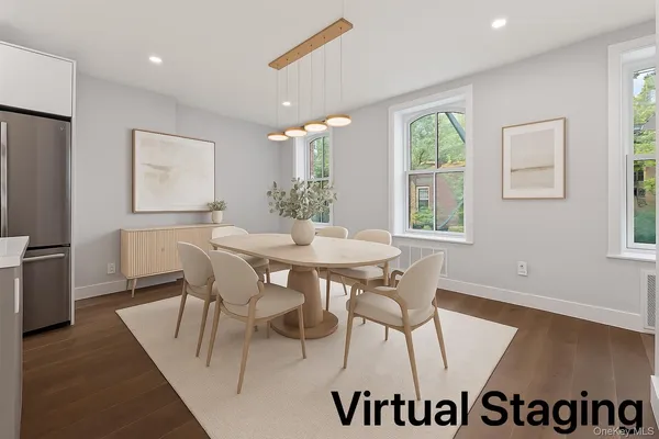 a view of a dining room with furniture and wooden floor