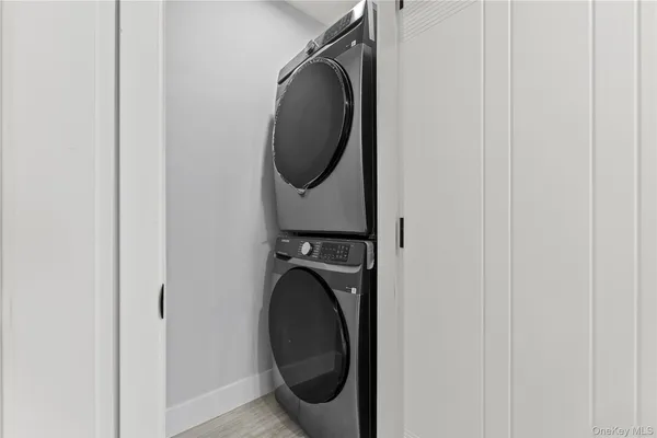 a close view of a utility room with dryer and washer