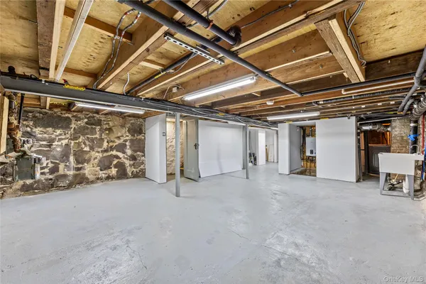 a view of an empty room with wooden walls