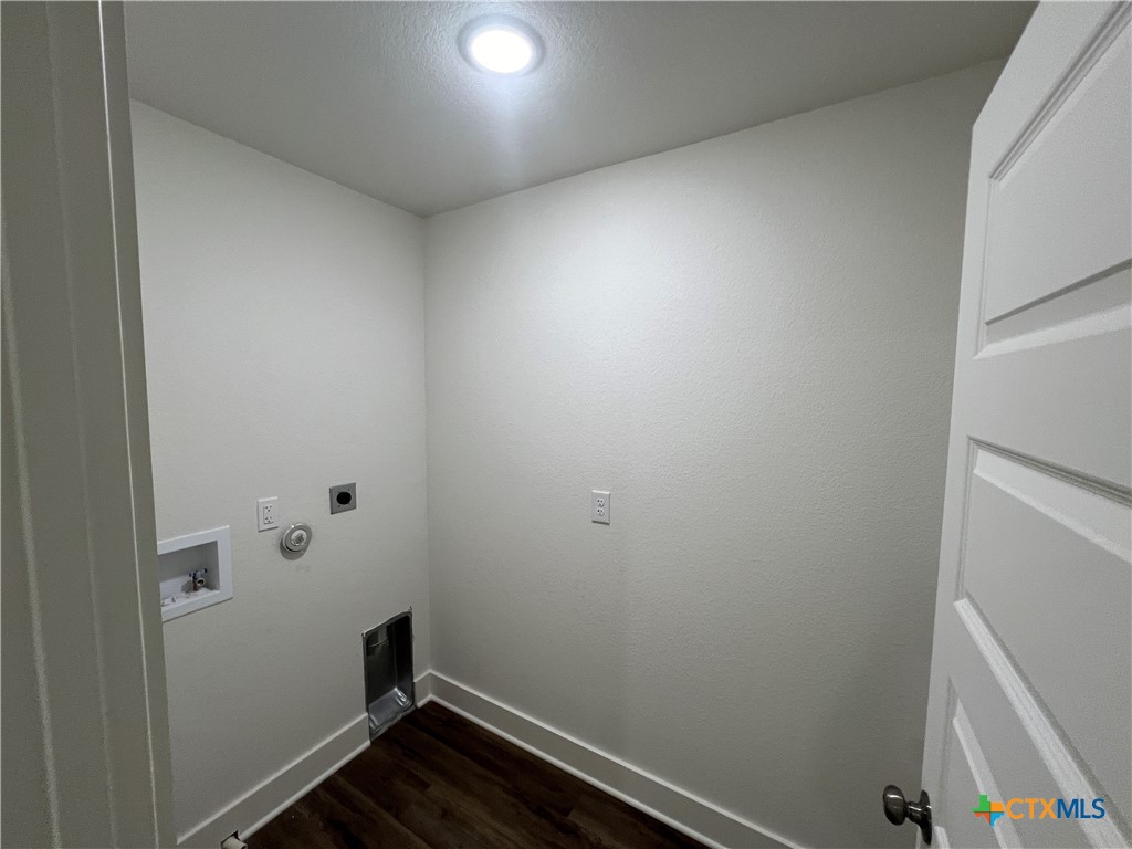 1814 Royal Loop Belton, TX 76513 - Photo 11 of 15 a room with linen closet and wooden floor