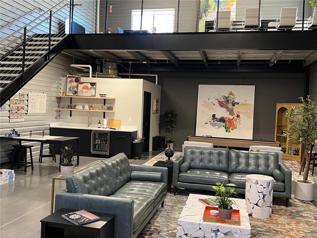 5725 Stables Way, Unit 308 Alpharetta, GA 30004 - Photo 2 of 7 a living room with furniture and wooden floor