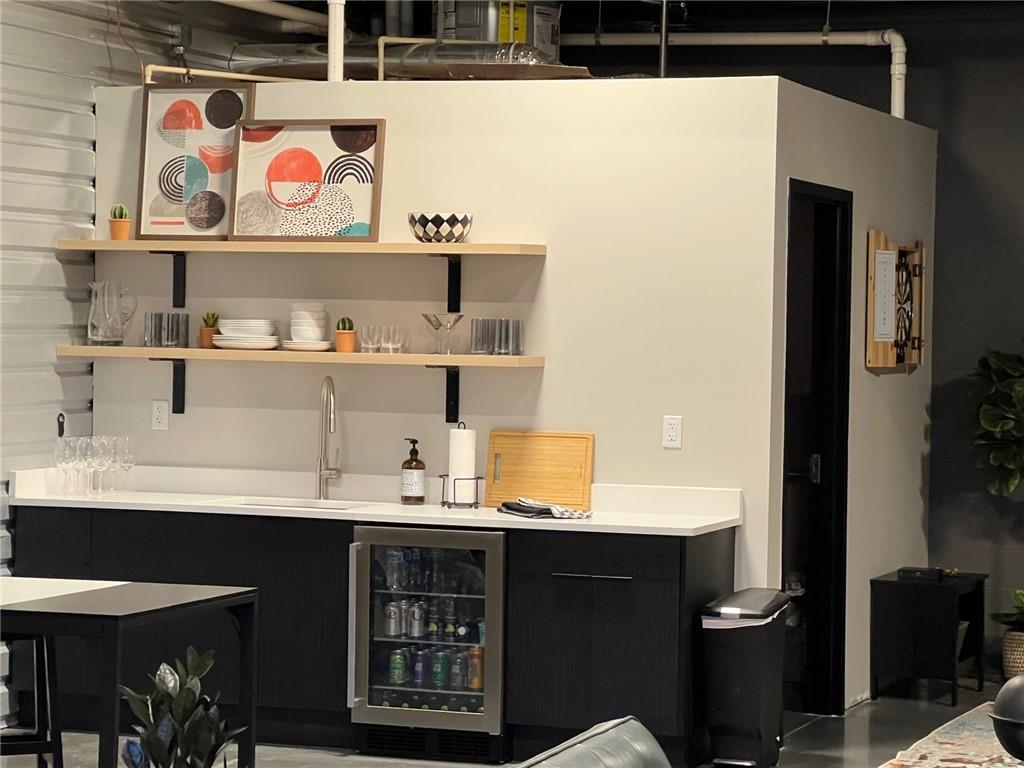 5725 Stables Way, Unit 308 Alpharetta, GA 30004 - Photo 6 of 7 a bathroom with a sink and a mirror