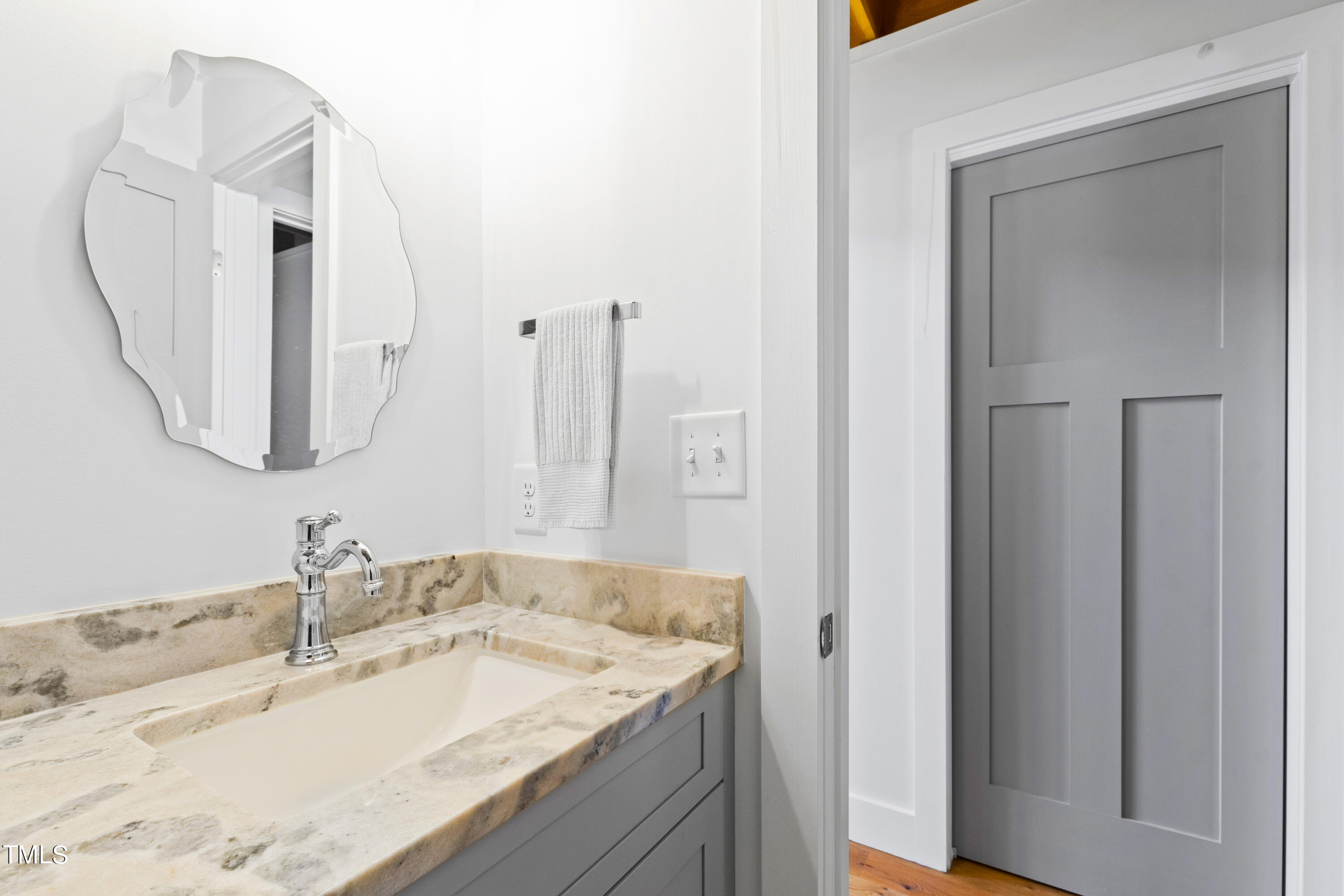 7915 McKee Road Rougemont, NC 27572 - Photo 24 of 48 a bathroom with a granite countertop sink and a mirror