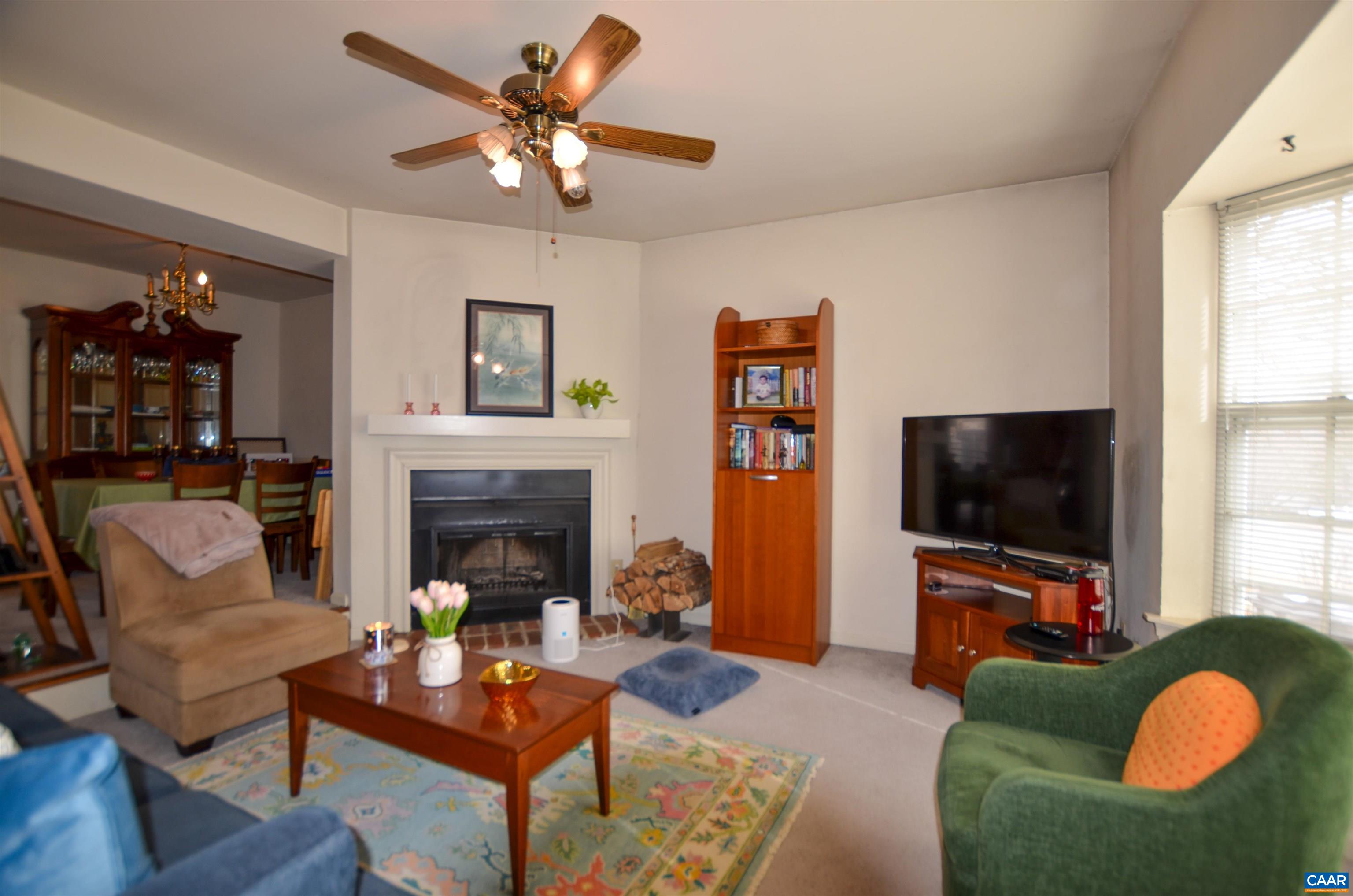 1594 Cool Spring Road Charlottesville, VA 22901 - Photo 3 of 26 a living room with furniture a fireplace and a flat screen tv