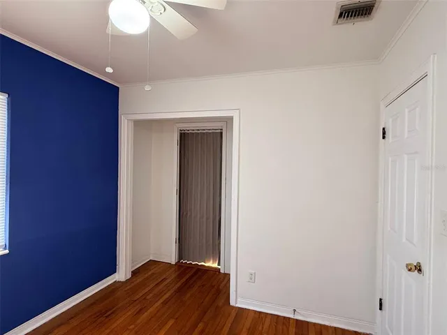 a view of a livingroom with wooden floor