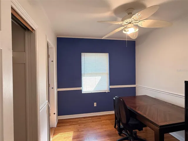 a workspace with furniture and window