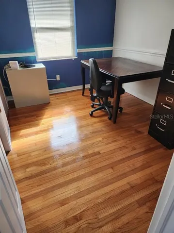 a workspace with furniture and window