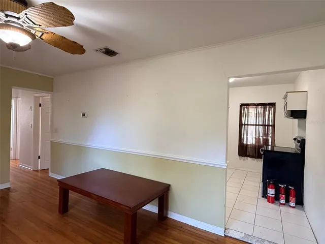 a room with furniture and wooden floor