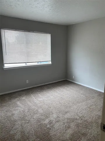 a view of a kitchen with a sink cabinets and wooden floor