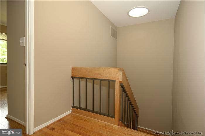 11711 Indian Ridge Road Reston, VA 20191 - Photo 18 of 30 Upper Level Stairwell Hall with Solar Tube