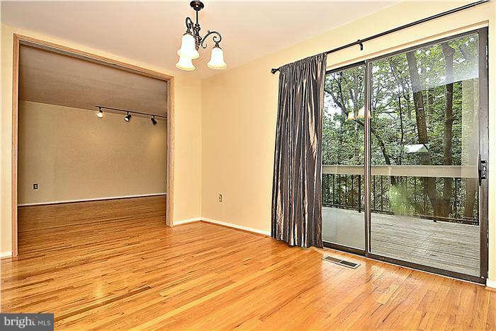 11711 Indian Ridge Road Reston, VA 20191 - Photo 7 of 30 Dining Room Leads to Deck Overlooking Nature