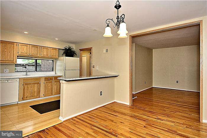 11711 Indian Ridge Road Reston, VA 20191 - Photo 9 of 30 Kitchen Has Been Opened Up Breakfast Bar Added