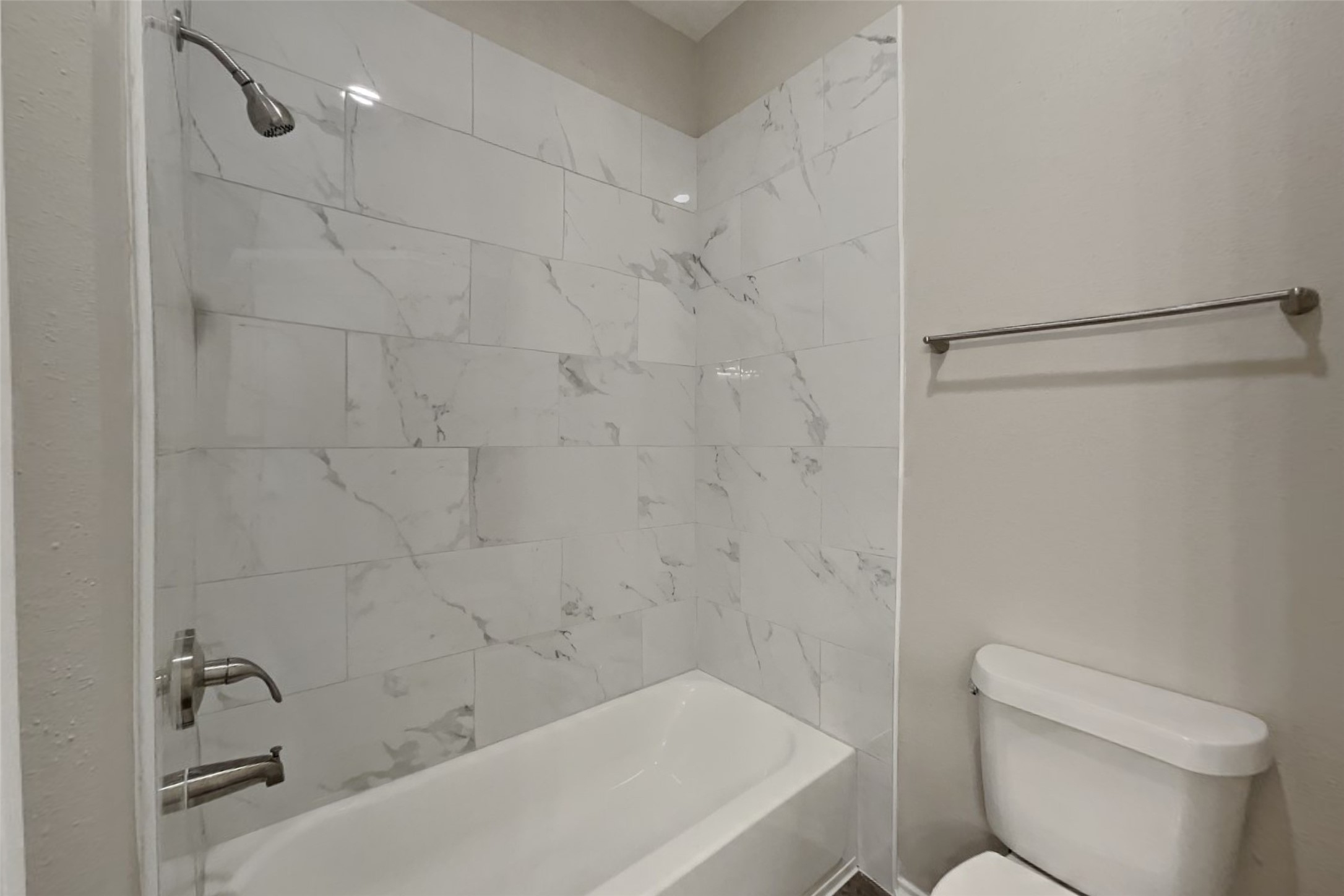 1511 Miller Avenue Katy, TX 77493 - Photo 12 of 23 a bathroom with a bathtub and a toilet