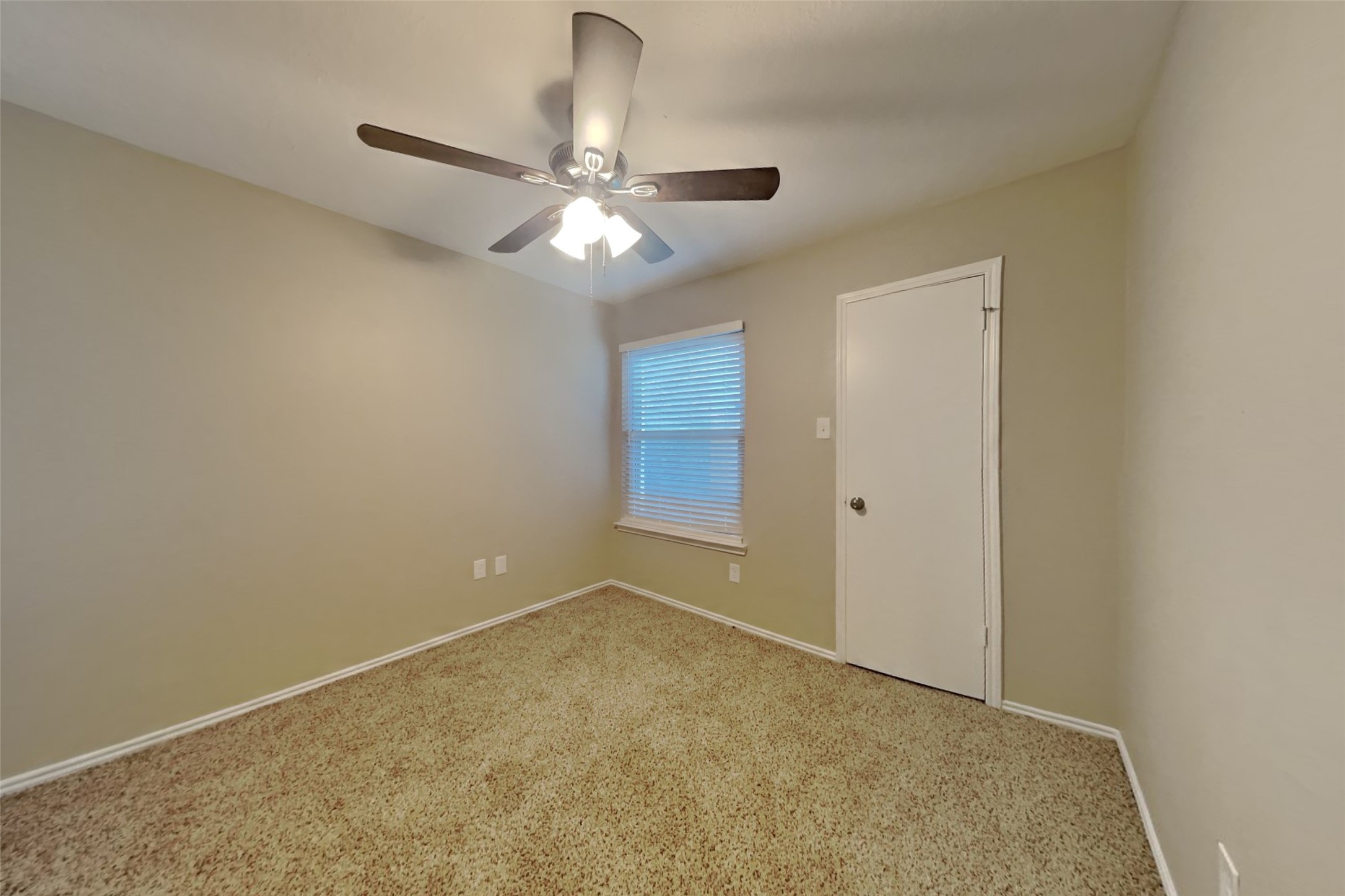 1511 Miller Avenue Katy, TX 77493 - Photo 18 of 23 an empty room with a chandelier fan and closet