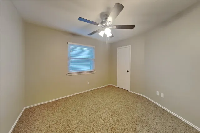 a bathroom with a sink vanity and toilet