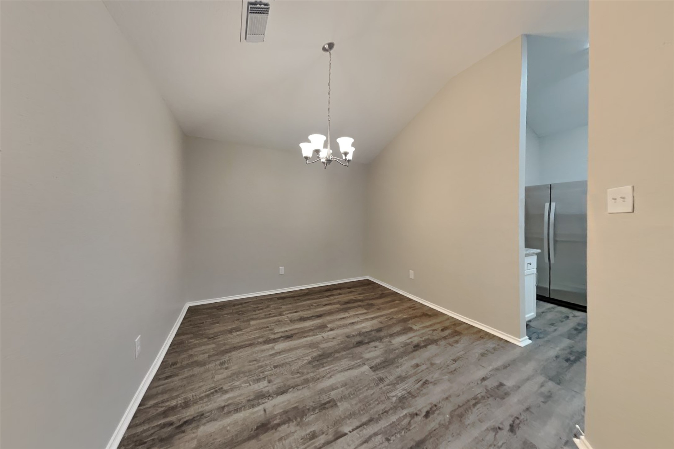 1511 Miller Avenue Katy, TX 77493 - Photo 7 of 23 a view of a room with wooden floor and white walls