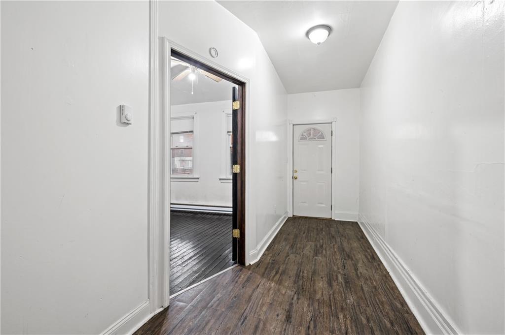 902 Robinson Street McKees Rocks, PA 15136 - Photo 14 of 31 a view of hallway with wooden floor