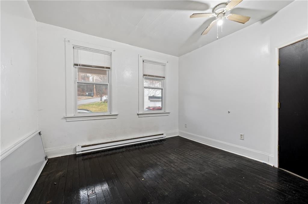 902 Robinson Street McKees Rocks, PA 15136 - Photo 15 of 31 wooden floor in an empty room with a window