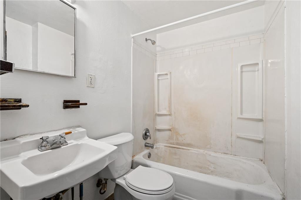 902 Robinson Street McKees Rocks, PA 15136 - Photo 17 of 31 a bathroom with a sink toilet and shower