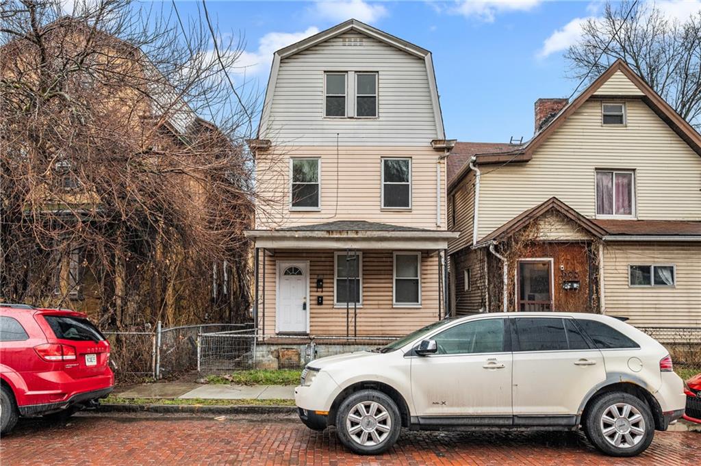 902 Robinson Street McKees Rocks, PA 15136 - Photo 2 of 31 a car parked in front of a house