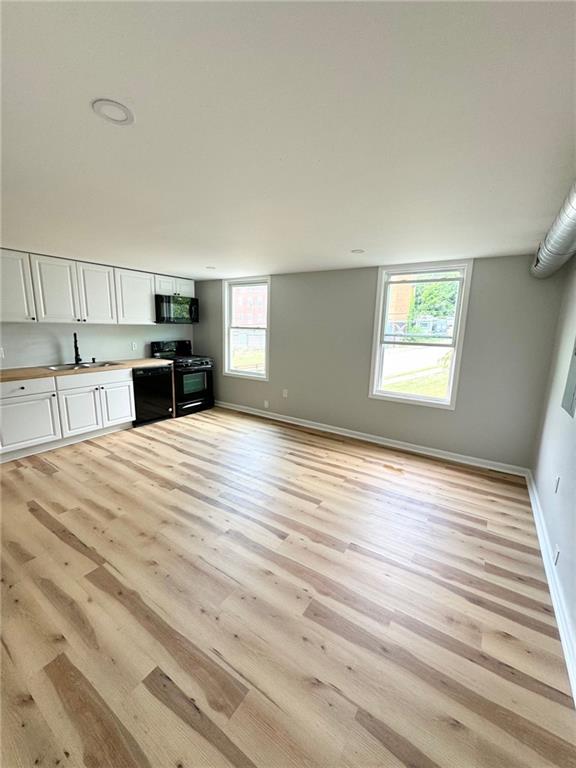 902 Robinson Street McKees Rocks, PA 15136 - Photo 21 of 31 a room with a bed and furniture