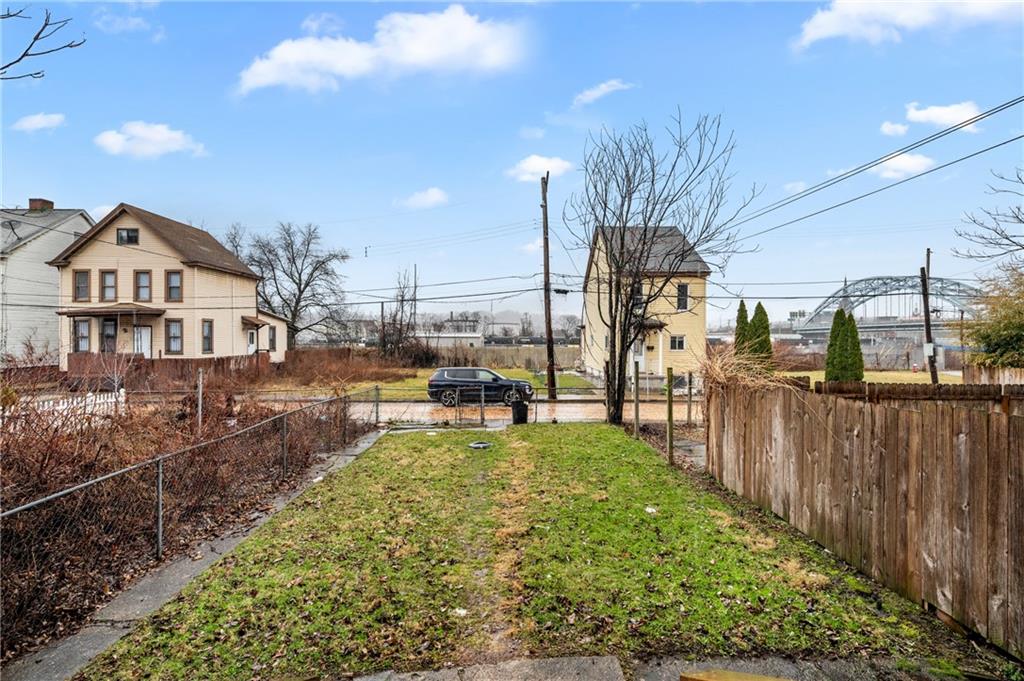 902 Robinson Street McKees Rocks, PA 15136 - Photo 30 of 31 a view of a house with backyard outdoor seating and hardwood