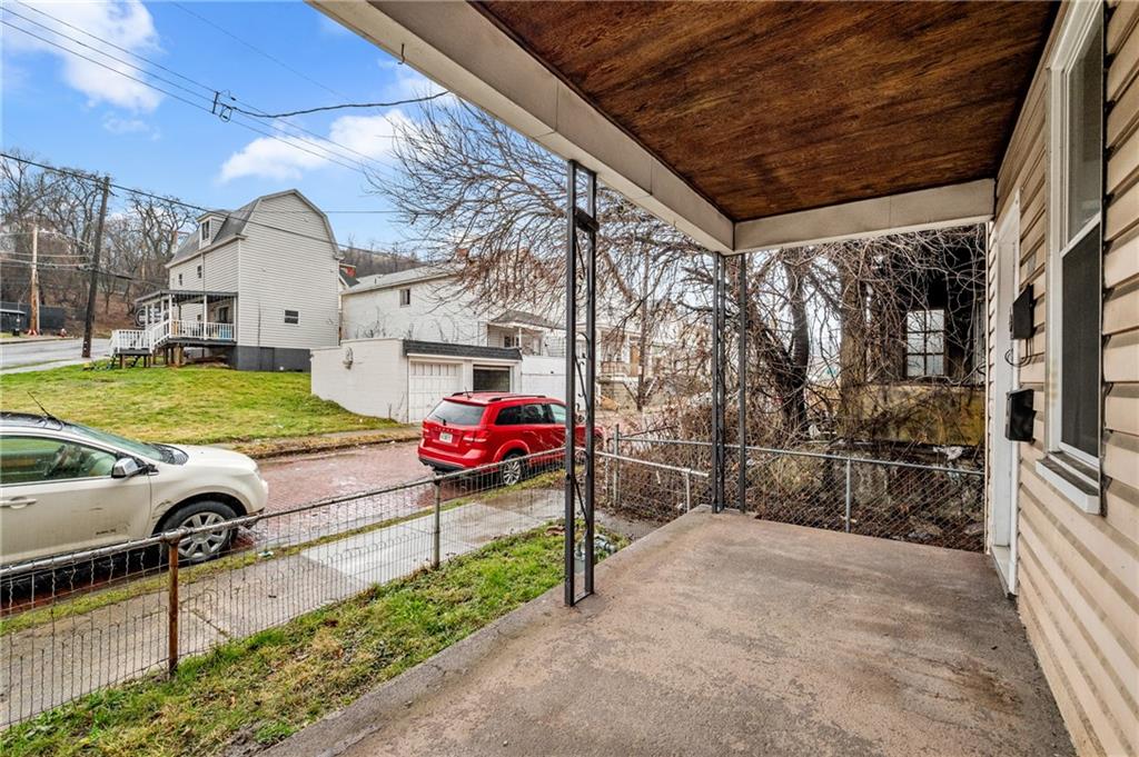 902 Robinson Street McKees Rocks, PA 15136 - Photo 3 of 31 a view of a chairs and table in the patio