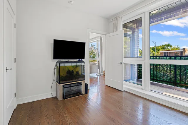 a living room with fireplace furniture and a flat screen tv