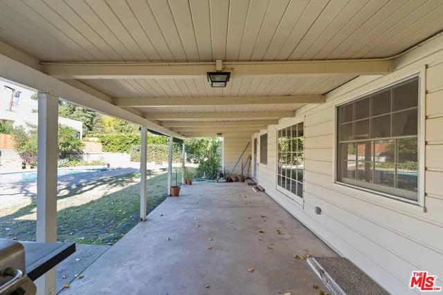 a view of a swimming pool with a patio