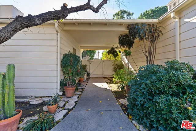 an aerial view of a house with a yard and garden