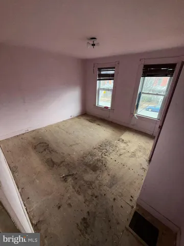 a view of a room with window and stairs