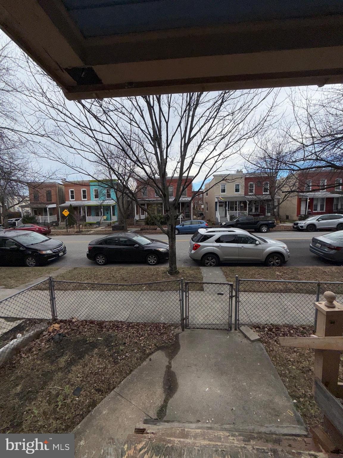 3113 Barclay Street Baltimore, MD 21218 - Photo 2 of 31 a view of a street with cars