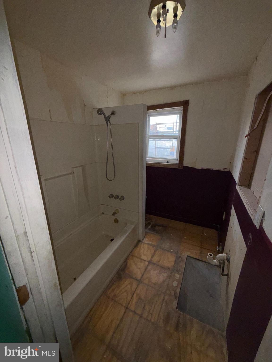 3113 Barclay Street Baltimore, MD 21218 - Photo 23 of 31 a bathroom with a bathtub and shower