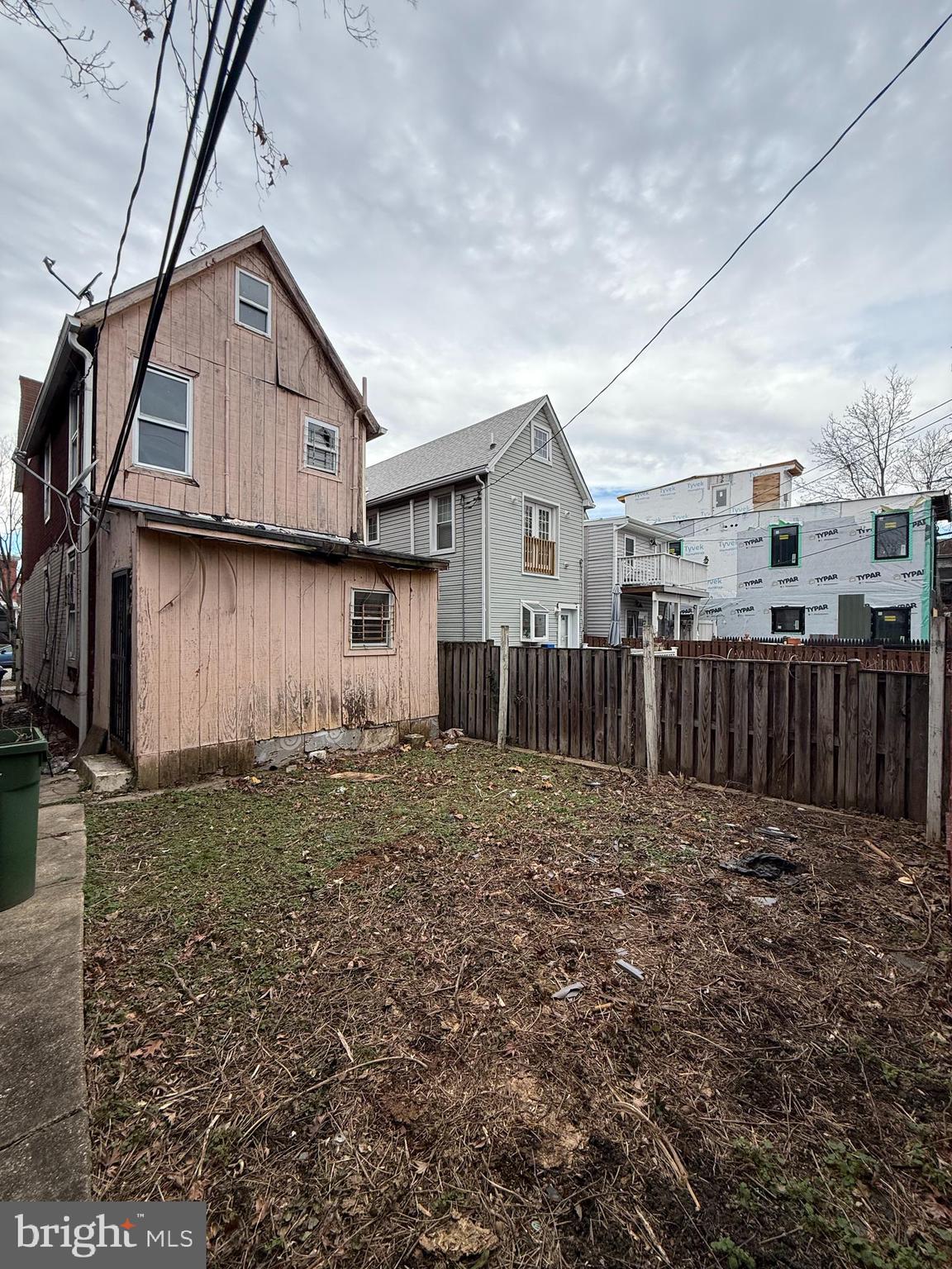 3113 Barclay Street Baltimore, MD 21218 - Photo 7 of 31 a view of backyard of house with wooden fence
