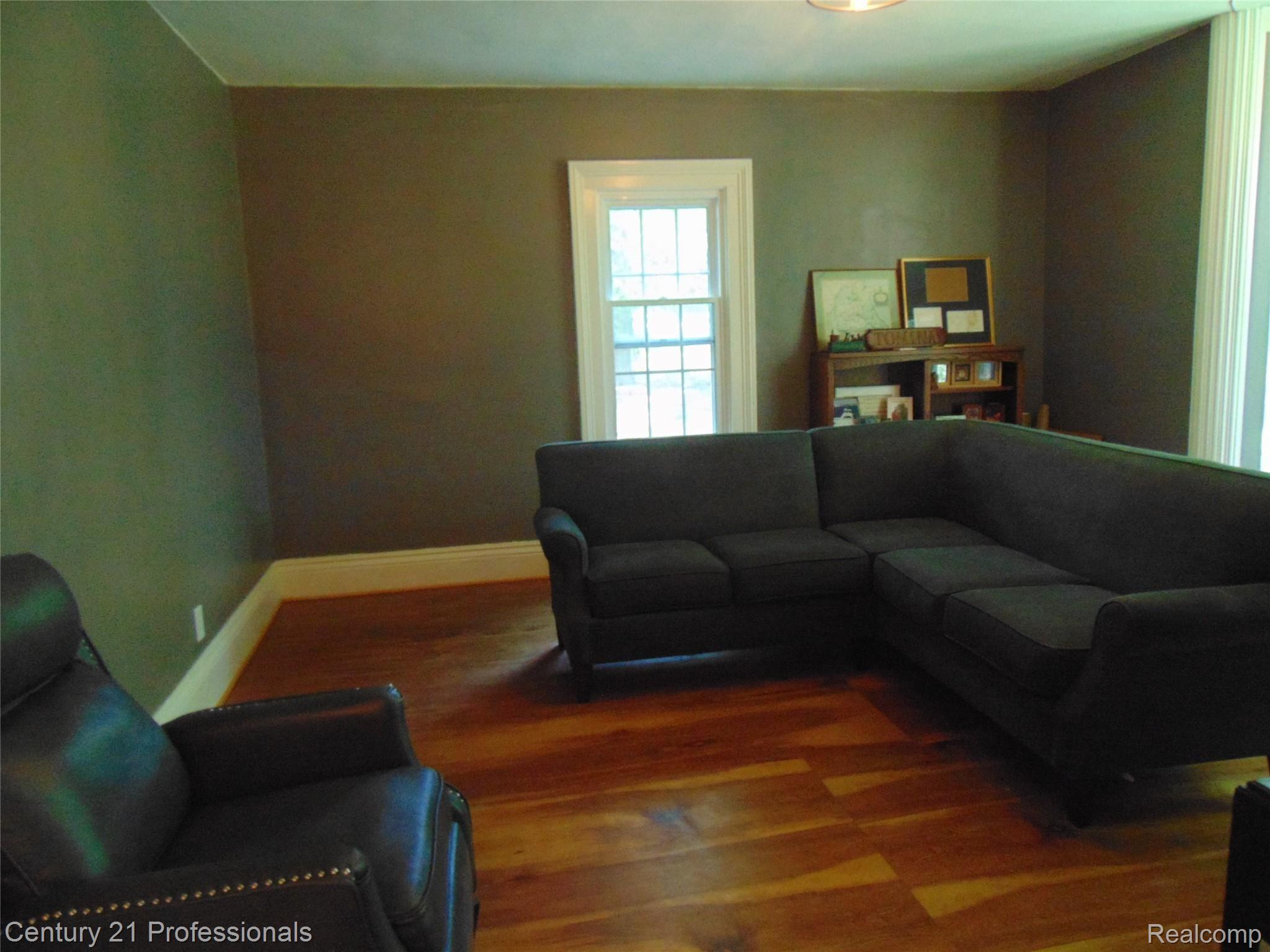 7222 Tucker Road Holly, MI 48442 - Photo 14 of 36 Another View of the Living room shows the Wide Baseboard Trim.....