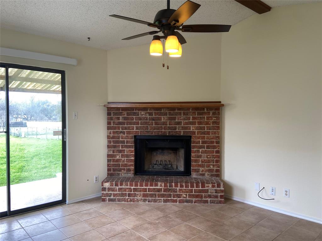 12800 Old San Antonio Road, Unit A Manchaca, TX 78652 - Photo 12 of 38 a living room with fireplace