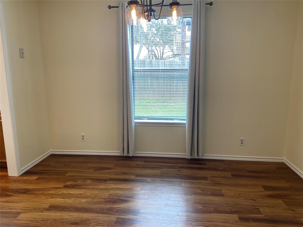 12800 Old San Antonio Road, Unit A Manchaca, TX 78652 - Photo 13 of 39 a view of wooden floor and windows in a room