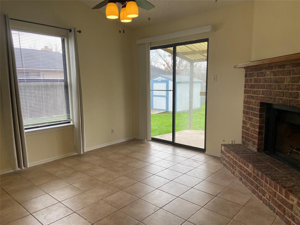 12800 Old San Antonio Road, Unit A Manchaca, TX 78652 - Photo 14 of 38 a view of an empty room with window and fire place
