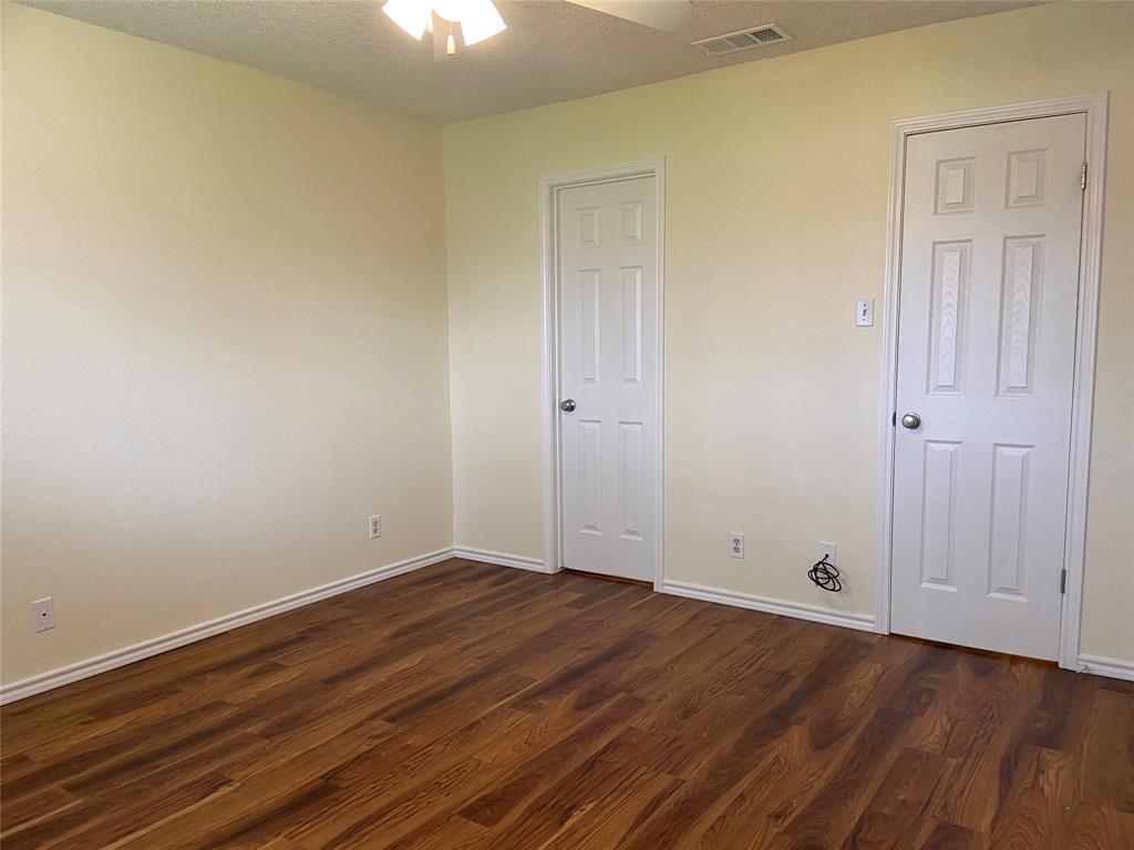 12800 Old San Antonio Road, Unit A Manchaca, TX 78652 - Photo 19 of 38 a view of room with wooden floor