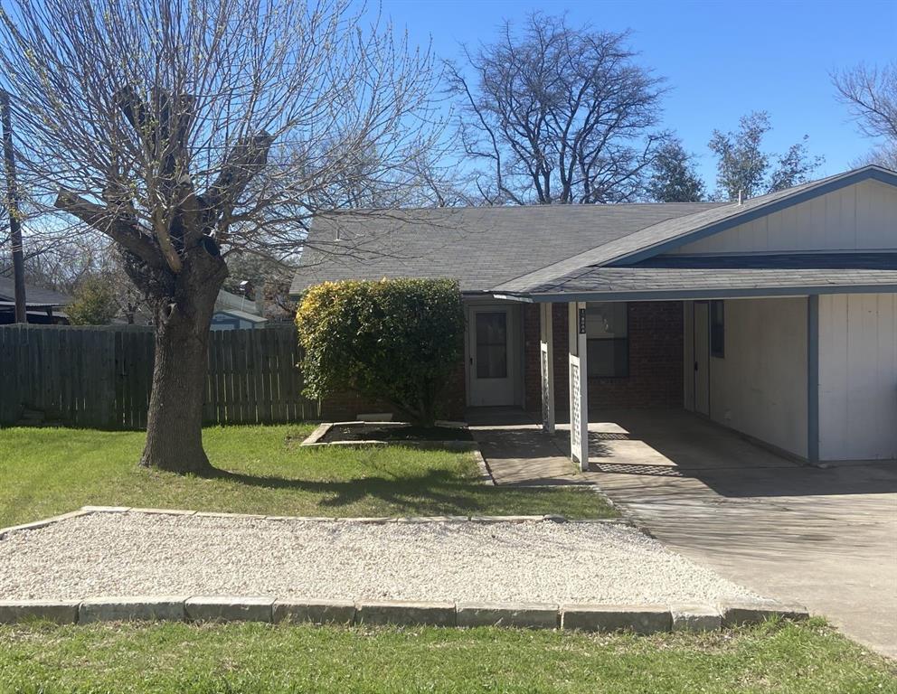 12800 Old San Antonio Road, Unit A Manchaca, TX 78652 - Photo 2 of 39 a front view of a house with garden