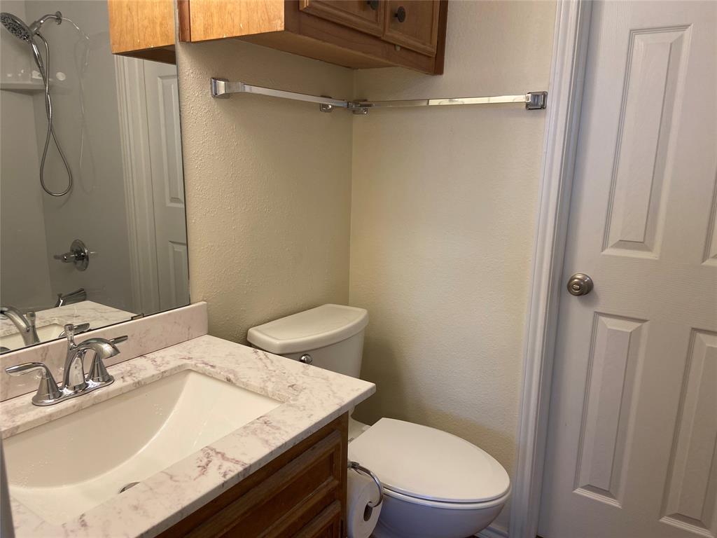 12800 Old San Antonio Road, Unit A Manchaca, TX 78652 - Photo 24 of 39 a bathroom with a sink a toilet and shower