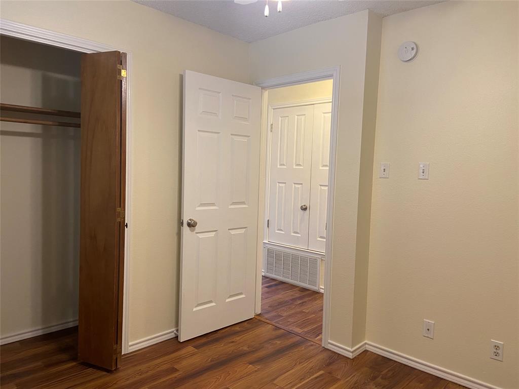 12800 Old San Antonio Road, Unit A Manchaca, TX 78652 - Photo 31 of 39 a view of empty room with wooden floor