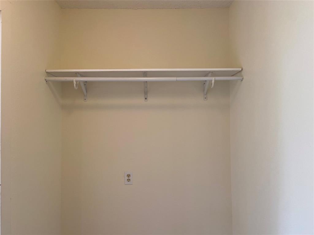 12800 Old San Antonio Road, Unit A Manchaca, TX 78652 - Photo 33 of 38 a view of a closet with racks on the wall
