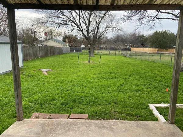 a view of a park with large trees