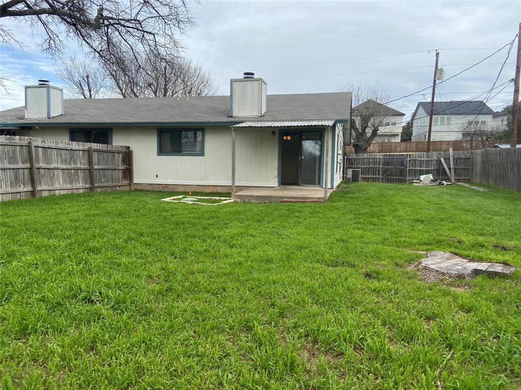 12800 Old San Antonio Road, Unit A Manchaca, TX 78652 - Photo 37 of 38 a front view of a house with a yard