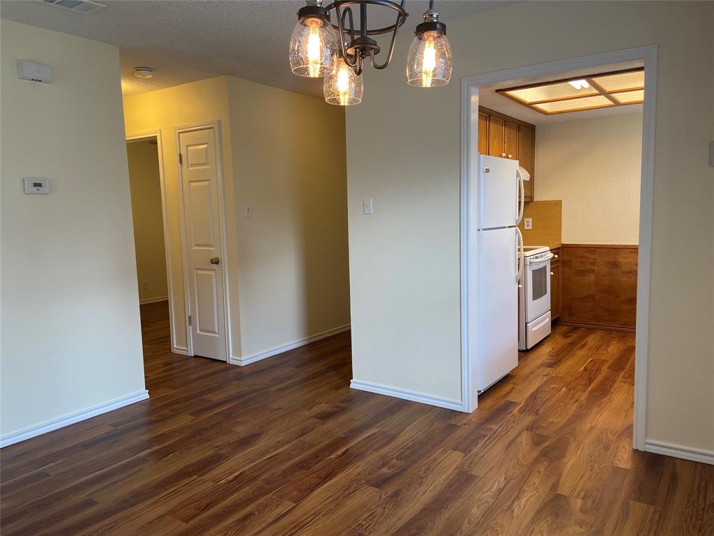 12800 Old San Antonio Road, Unit A Manchaca, TX 78652 - Photo 4 of 38 a view of a hallway with wooden floor
