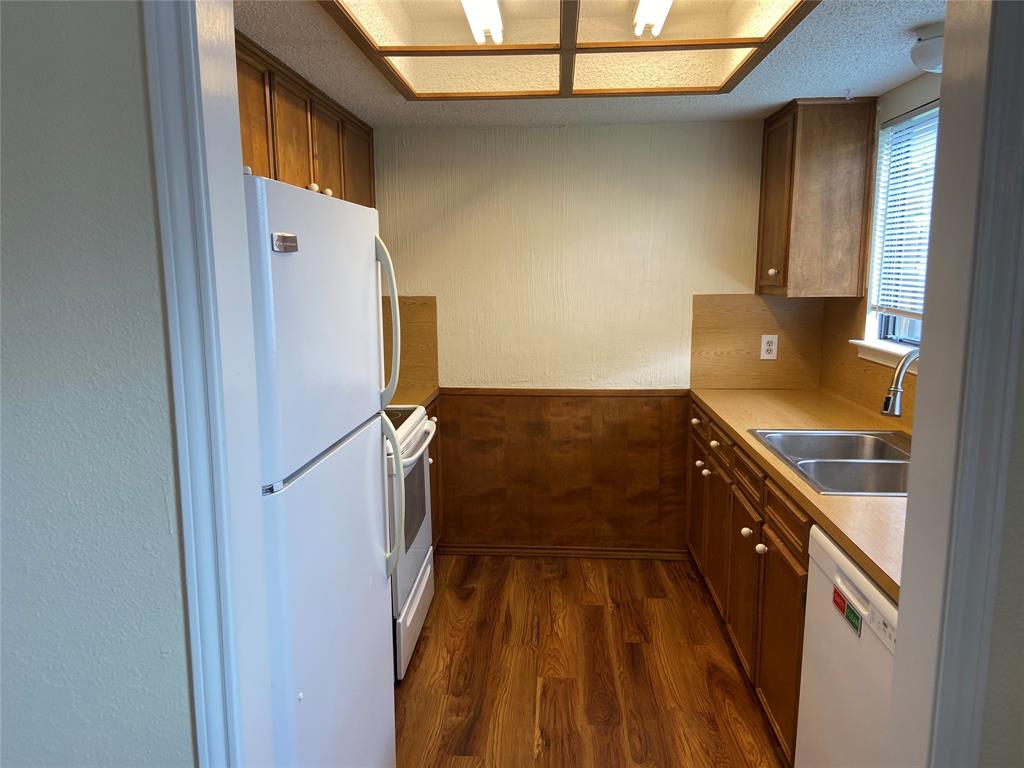 12800 Old San Antonio Road, Unit A Manchaca, TX 78652 - Photo 8 of 39 a kitchen with a refrigerator and a stove