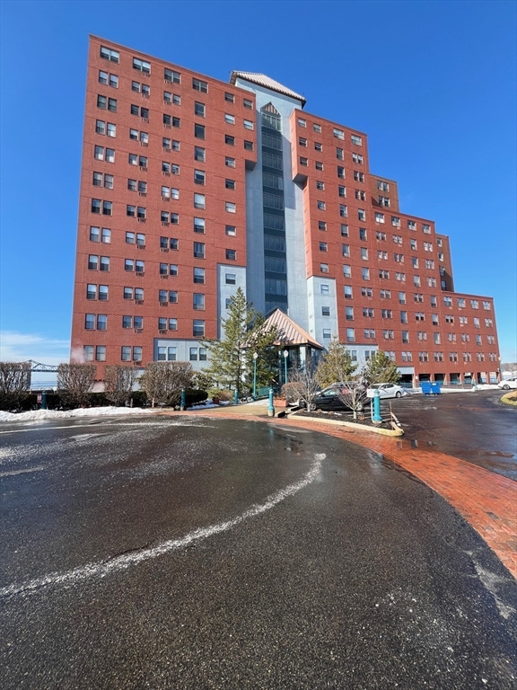 750 Davol Street, Unit 324 Fall River, MA 02720 - Photo 16 of 16 a city street lined with buildings and a street view